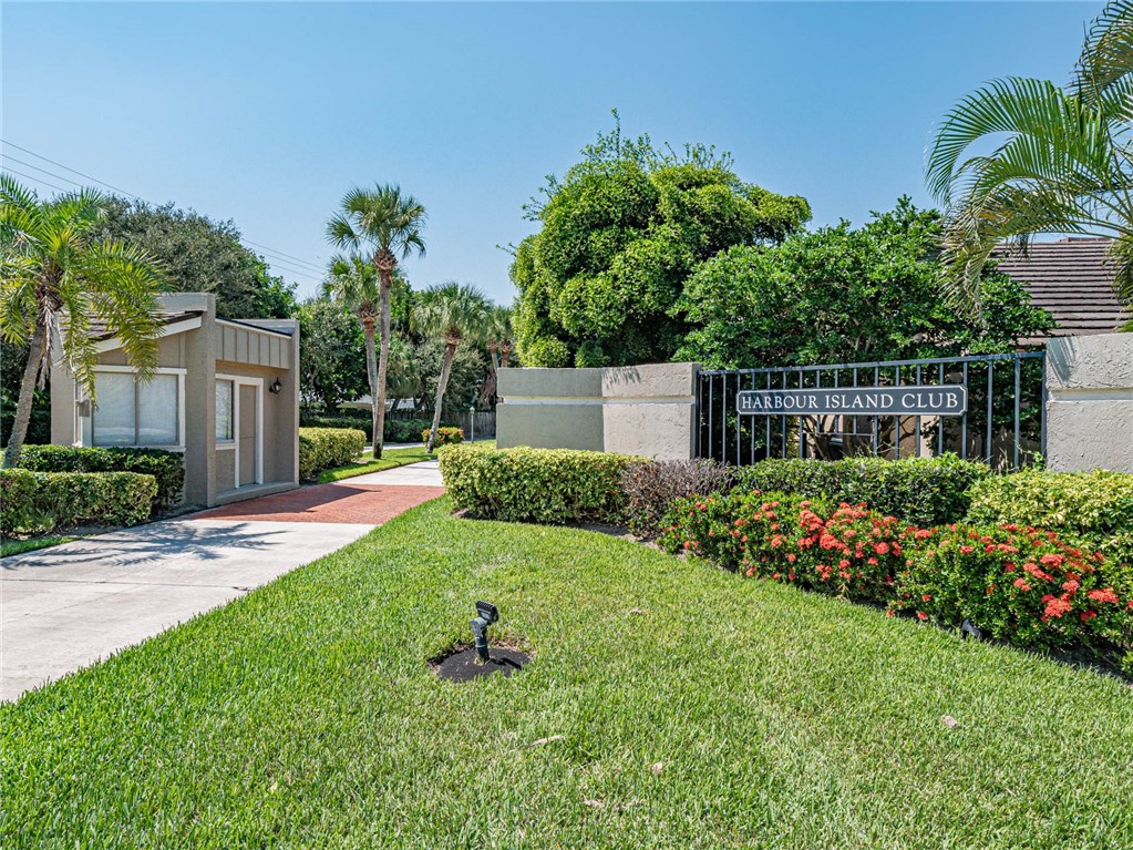 5101 Florida A1A, Unit 7 Vero Beach, FL 32963 - Photo 1 of 35 a view of a garden with a house in the background
