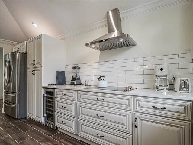 a kitchen with stainless steel appliances a sink and cabinets