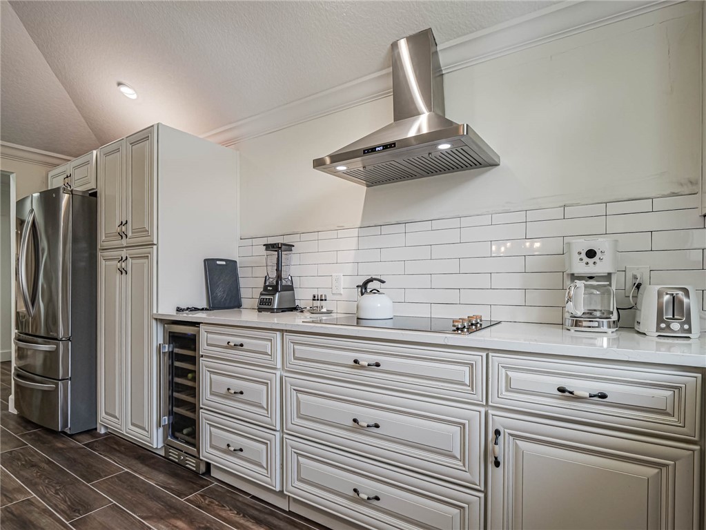 5101 Florida A1A, Unit 7 Vero Beach, FL 32963 - Photo 14 of 35 a kitchen with stainless steel appliances a sink and cabinets