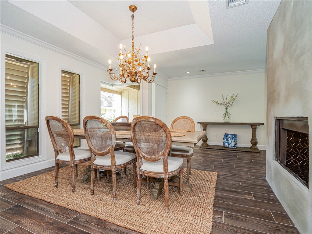 5101 Florida A1A, Unit 7 Vero Beach, FL 32963 - Photo 16 of 35 a view of a dining room with furniture window and wooden floor
