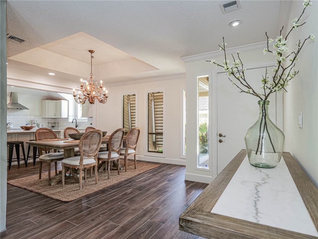 5101 Florida A1A, Unit 7 Vero Beach, FL 32963 - Photo 18 of 35 a view of a dining room with furniture window and wooden floor
