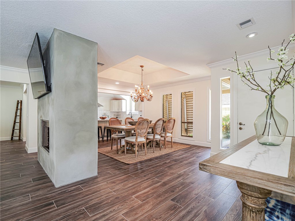 5101 Florida A1A, Unit 7 Vero Beach, FL 32963 - Photo 19 of 35 a dining room with furniture window and wooden floor