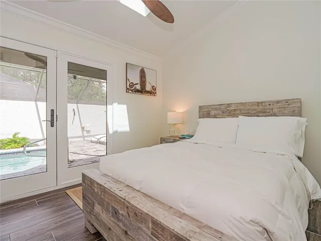 a bedroom with a large bed and a window