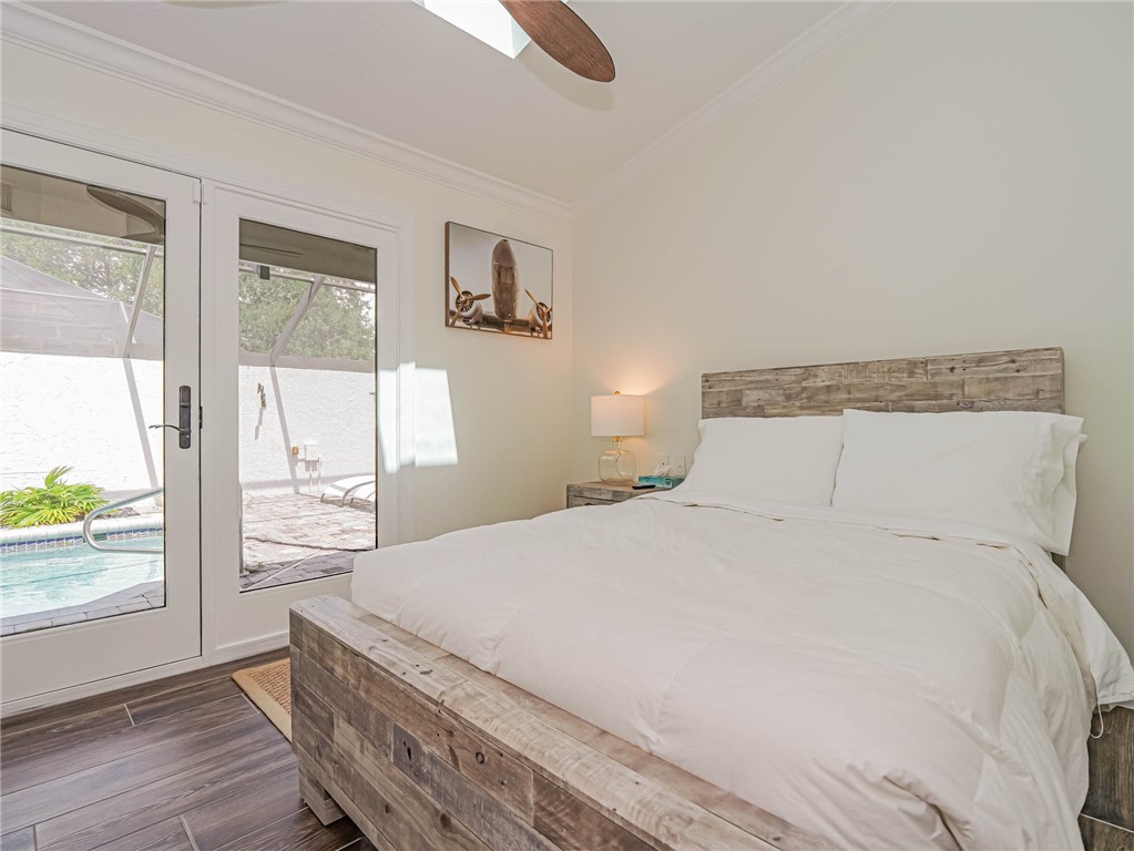 5101 Florida A1A, Unit 7 Vero Beach, FL 32963 - Photo 30 of 35 a bedroom with a large bed and a window