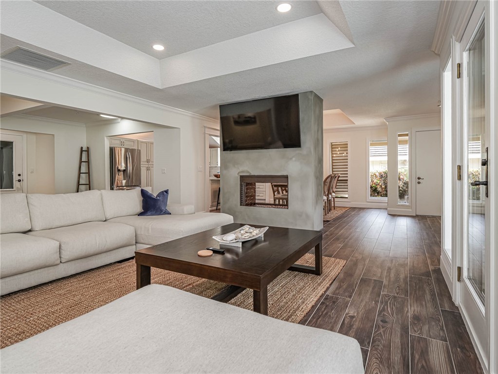 5101 Florida A1A, Unit 7 Vero Beach, FL 32963 - Photo 3 of 35 a living room with furniture and a fireplace