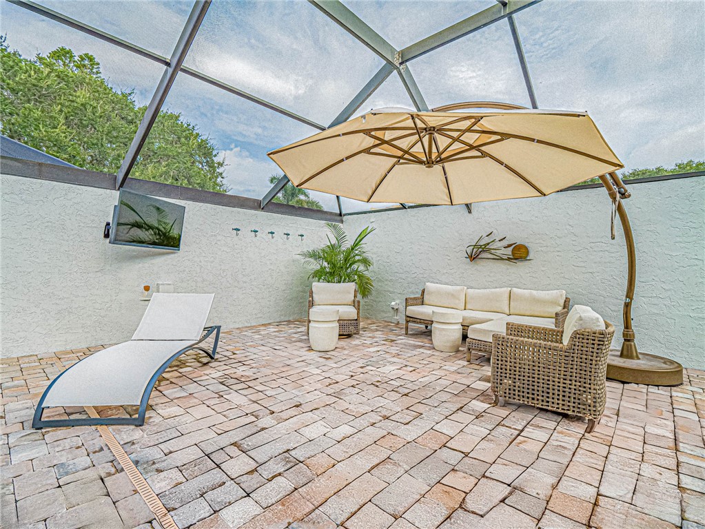 5101 Florida A1A, Unit 7 Vero Beach, FL 32963 - Photo 35 of 35 a bedroom with a bed and a table