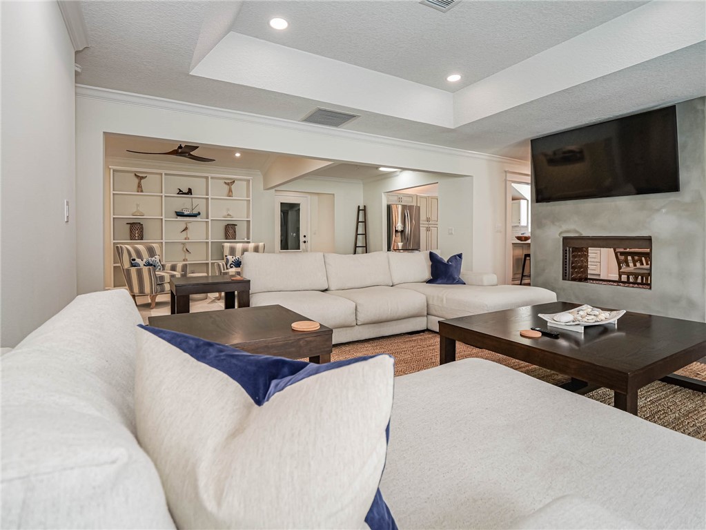 5101 Florida A1A, Unit 7 Vero Beach, FL 32963 - Photo 4 of 35 a living room with furniture and a flat screen tv