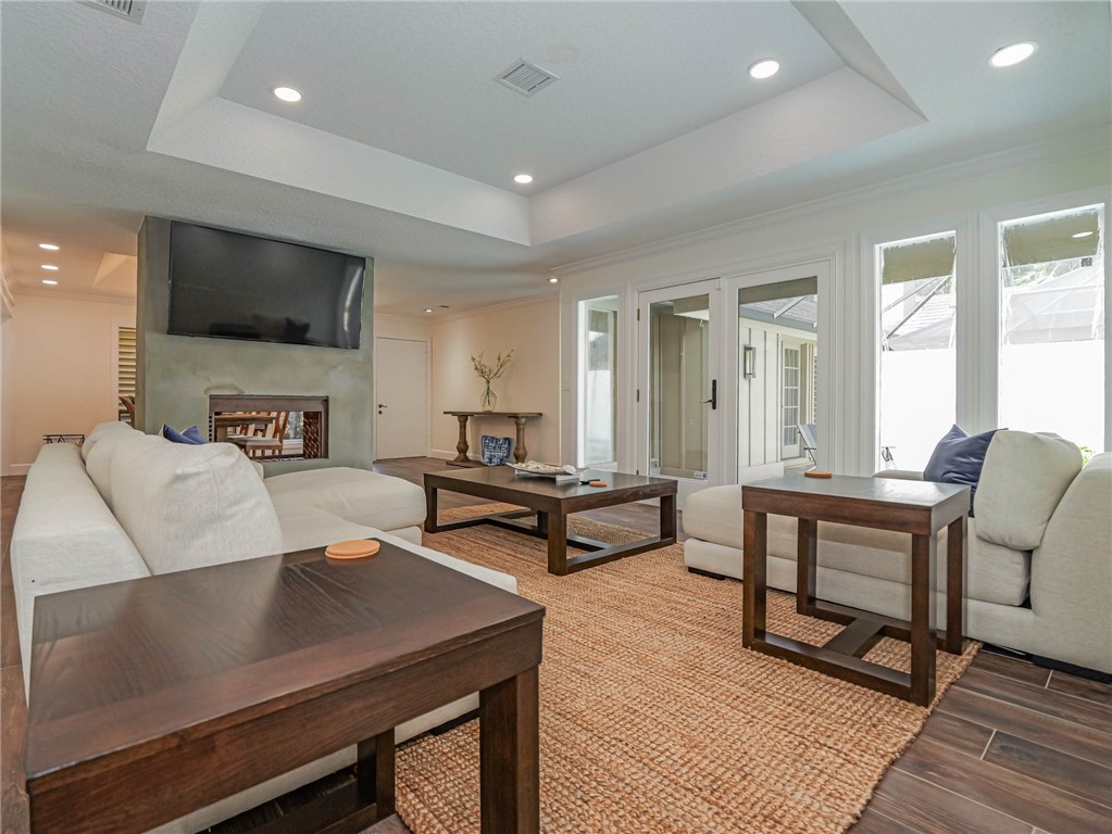 5101 Florida A1A, Unit 7 Vero Beach, FL 32963 - Photo 5 of 35 a living room with furniture and a flat screen tv