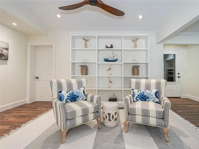 a living room with furniture and white walls