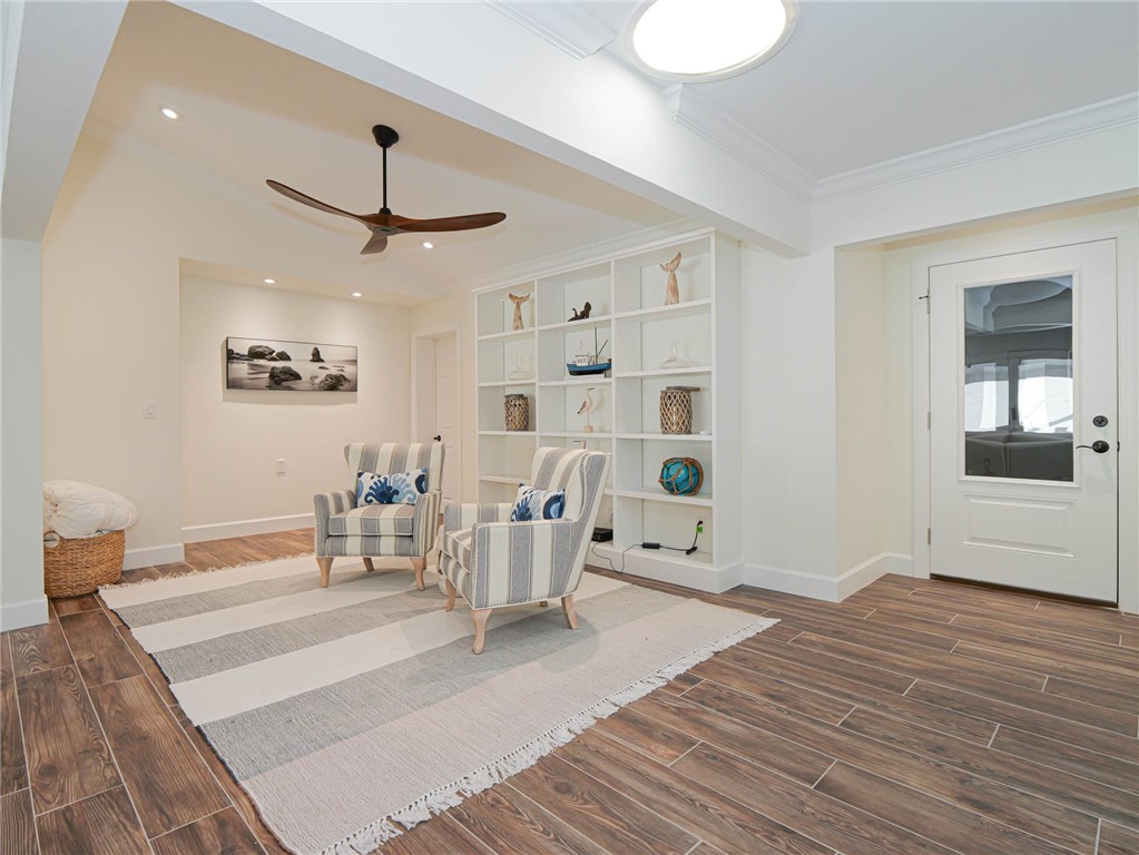 5101 Florida A1A, Unit 7 Vero Beach, FL 32963 - Photo 7 of 35 a living room with furniture and a chandelier