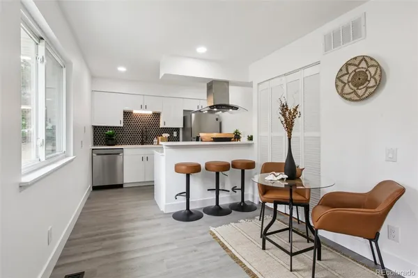 a kitchen with a sink and a refrigerator