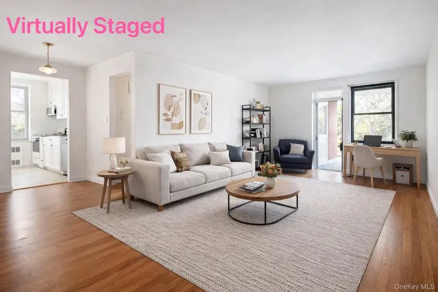 a living room with furniture or couch and a wooden floor