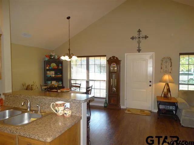 a dining room with furniture and wooden floor