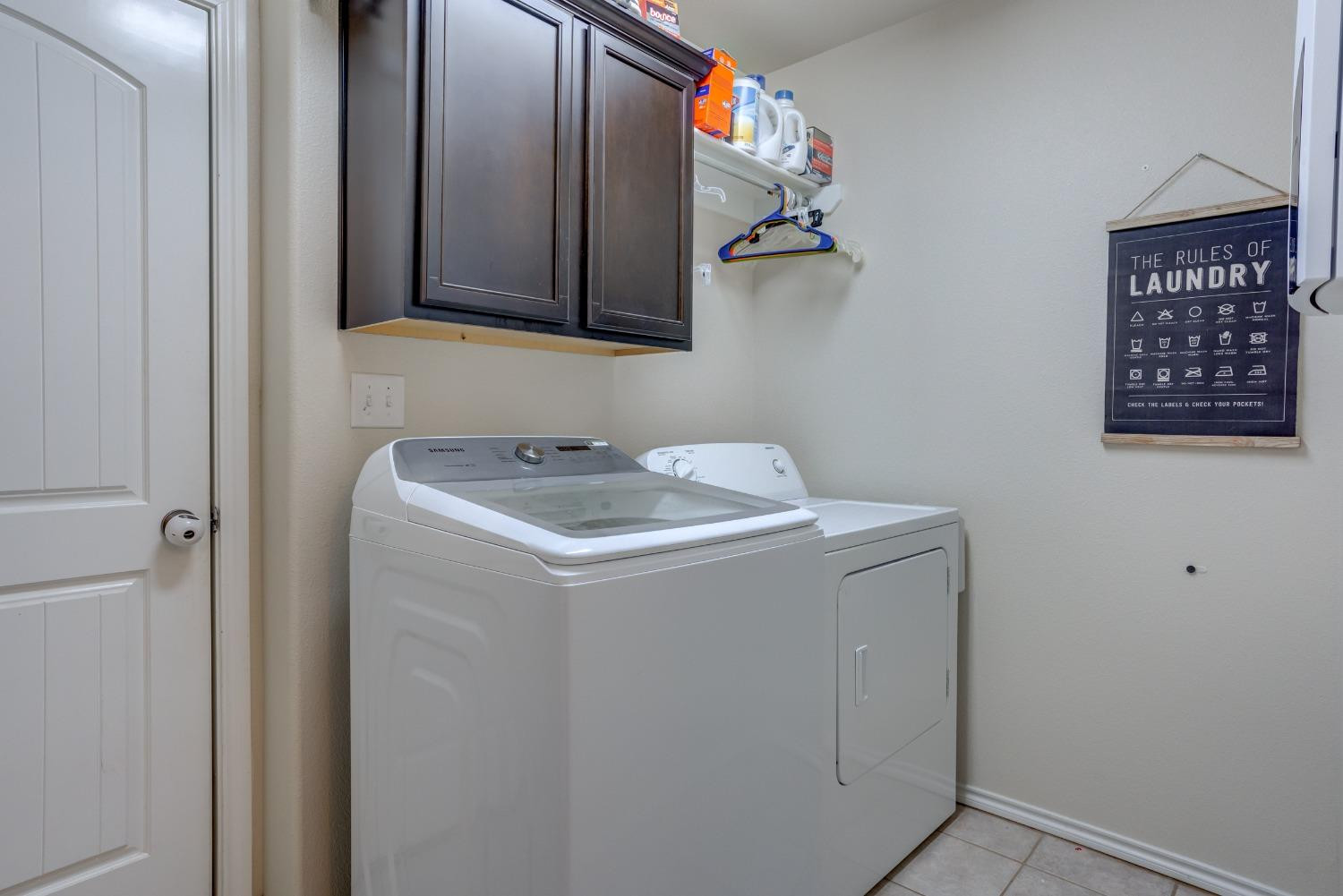 5725 110th Street Lubbock, TX 79424 - Photo 18 of 24 a utility room with dryer and washer