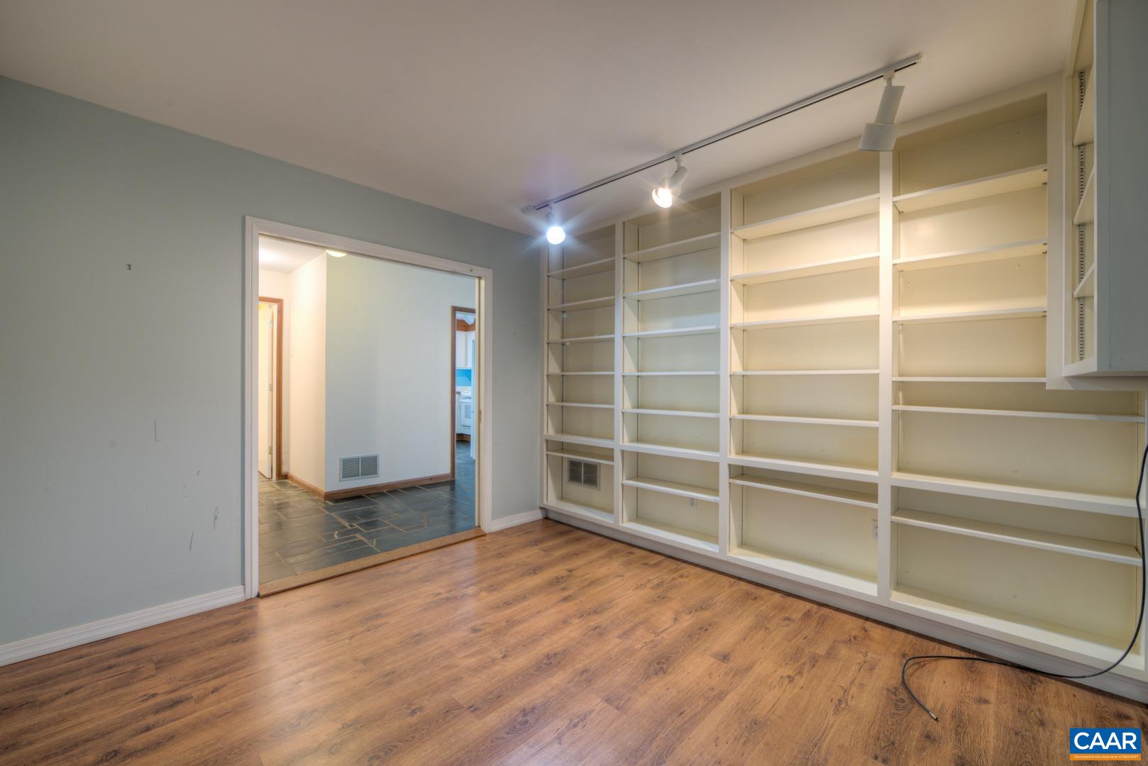305 Cedar Bluff Road Charlottesville, VA 22901 - Photo 15 of 37 a view of an empty room with wooden floor and a window