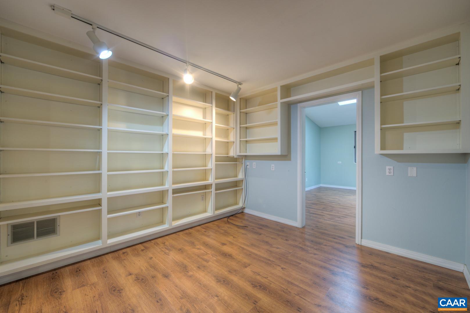 305 Cedar Bluff Road Charlottesville, VA 22901 - Photo 16 of 37 a view of an empty room with a window and wooden floor