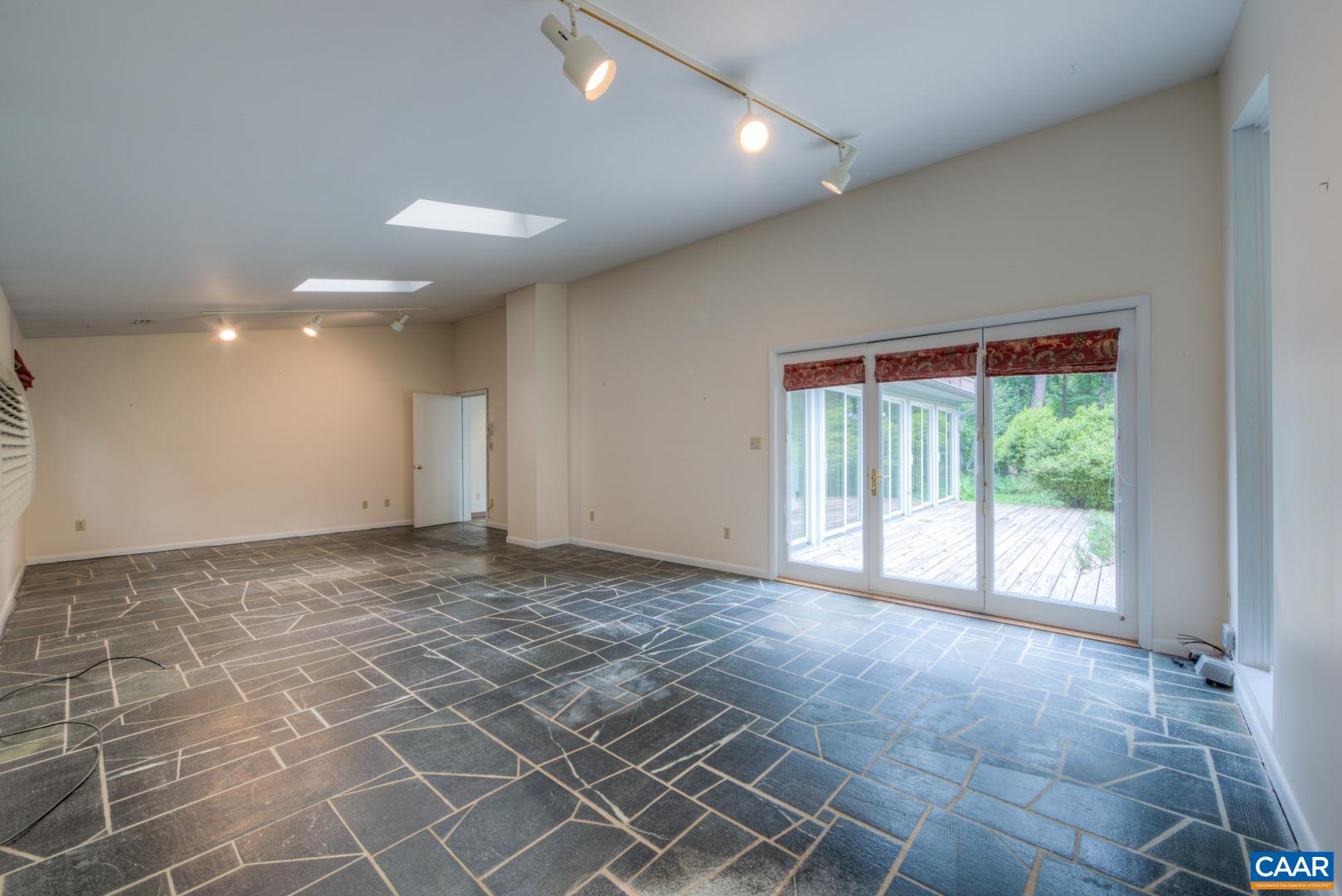 305 Cedar Bluff Road Charlottesville, VA 22901 - Photo 20 of 37 a view of an empty room with a window