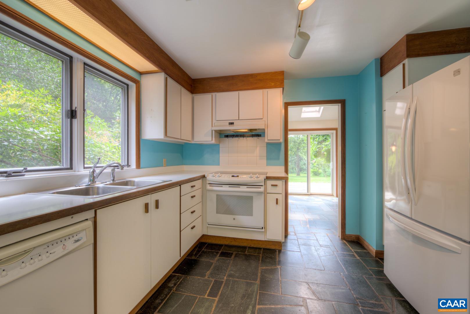 305 Cedar Bluff Road Charlottesville, VA 22901 - Photo 27 of 37 a kitchen with a sink a refrigerator and window