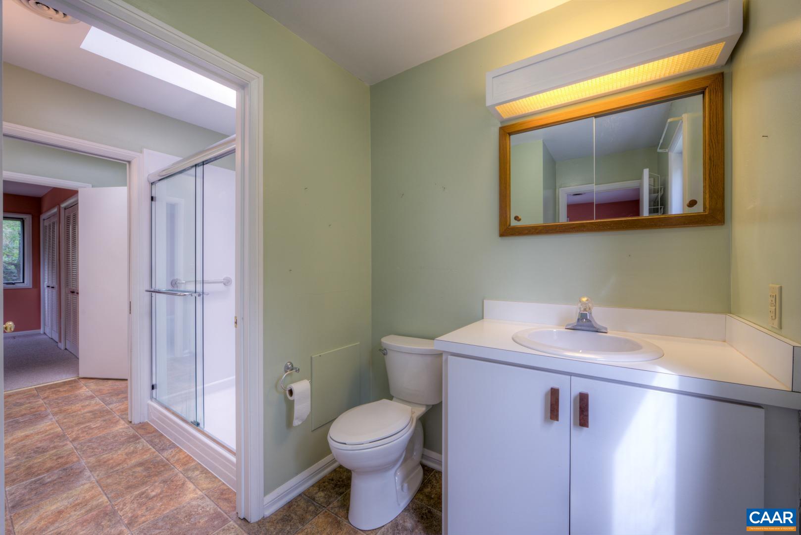 305 Cedar Bluff Road Charlottesville, VA 22901 - Photo 31 of 37 a bathroom with a sink and a mirror