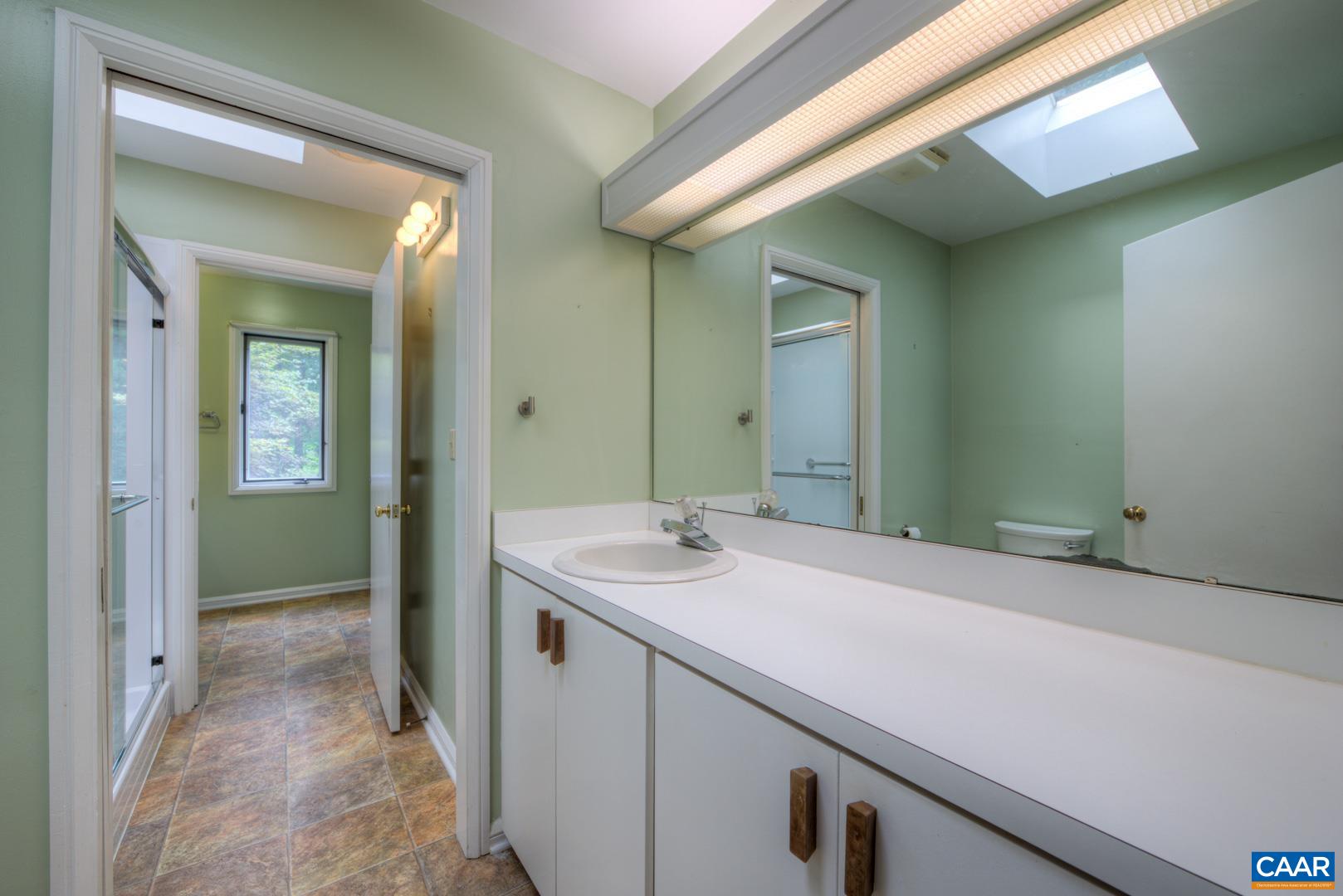 305 Cedar Bluff Road Charlottesville, VA 22901 - Photo 34 of 37 a bathroom with a sink and a mirror