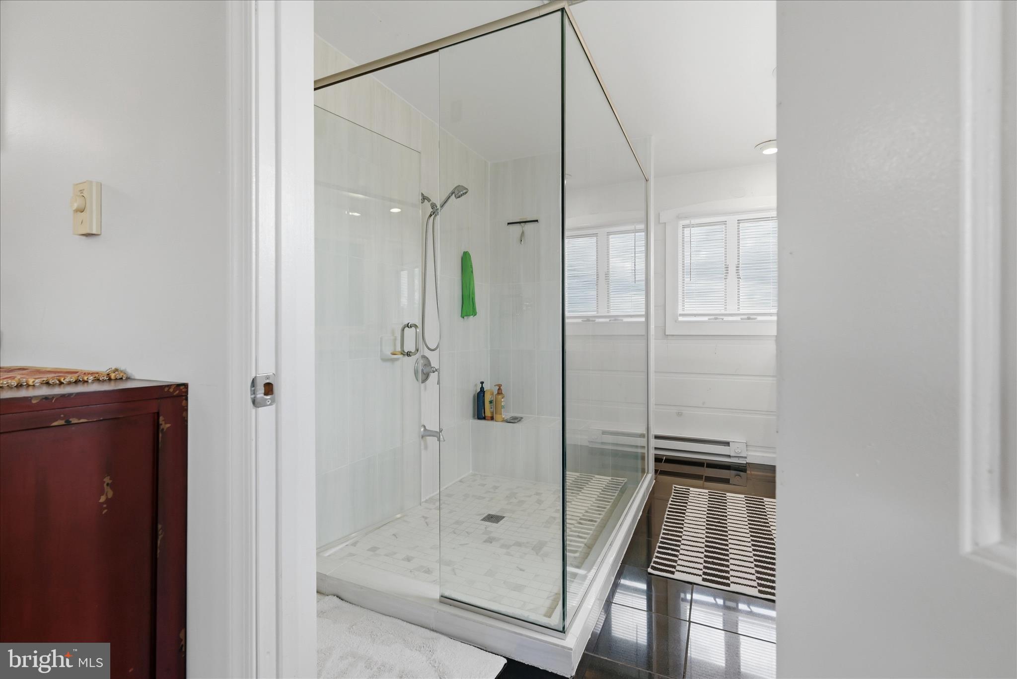 2121 South Pifer Road Star Tannery, VA 22654 - Photo 24 of 127 a bathroom with a glass shower door and a glass door