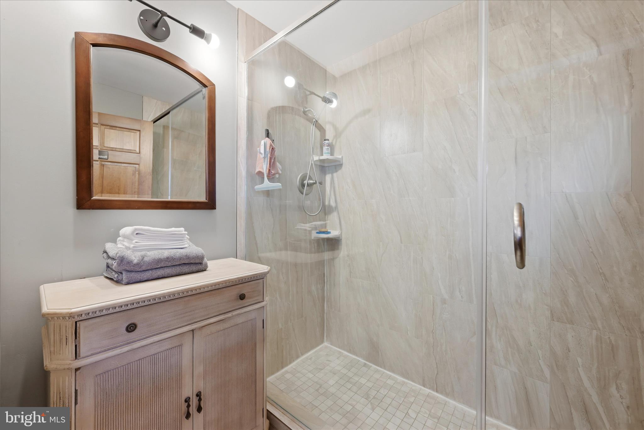 2121 South Pifer Road Star Tannery, VA 22654 - Photo 86 of 127 a bathroom with a sink a mirror a vanity and shower