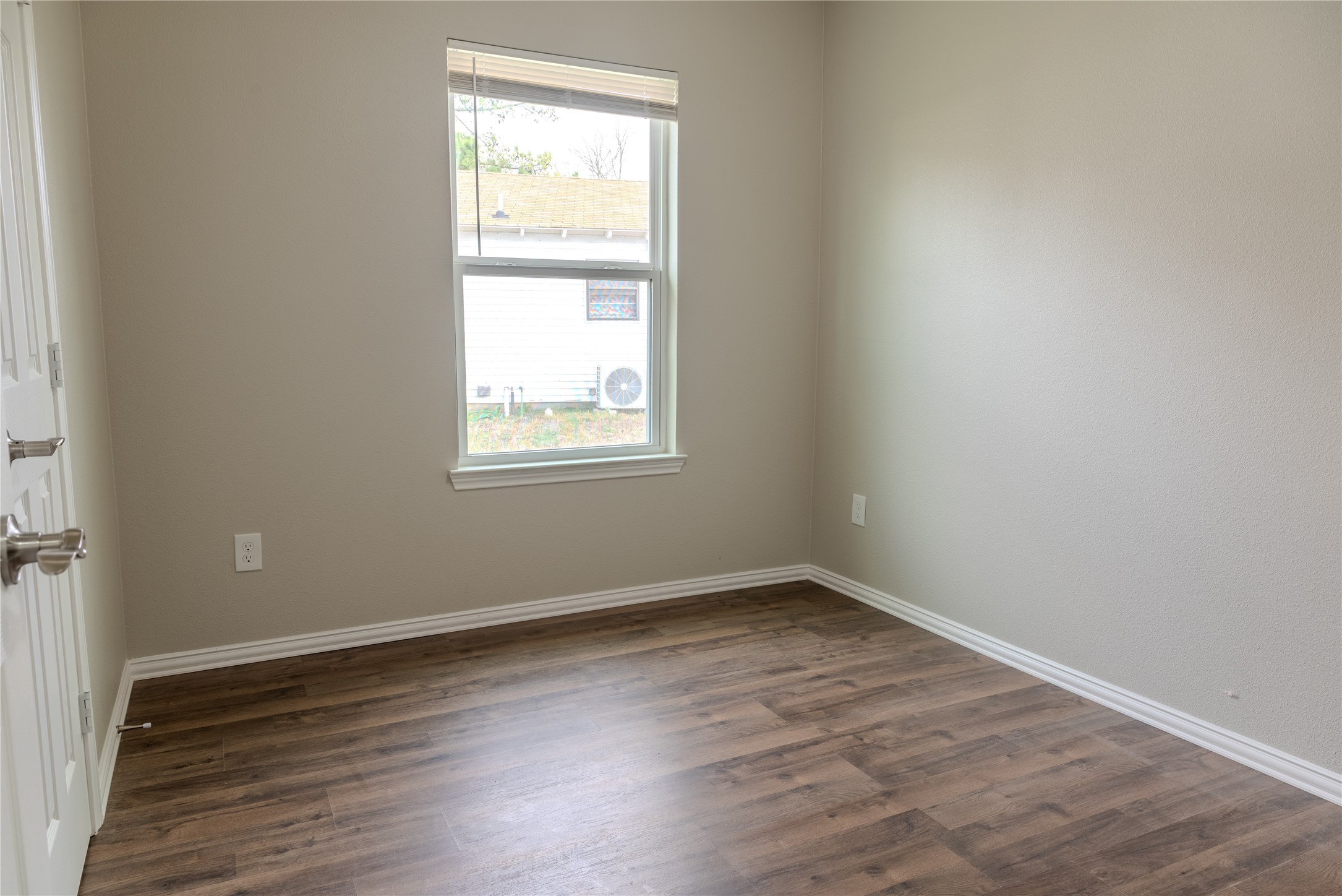 729 Planters Street Emory, TX 75440 - Photo 16 of 22 an empty room with wooden floor and windows