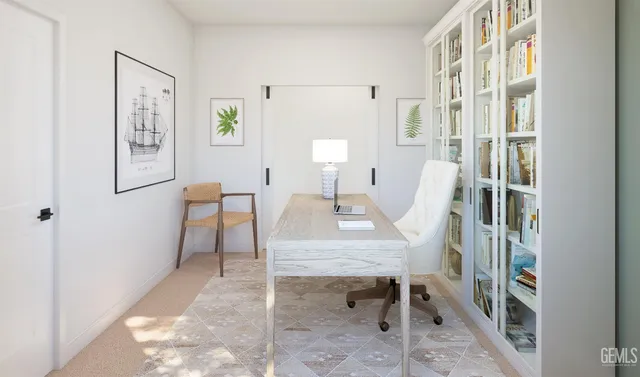 a view of a livingroom with furniture and a window