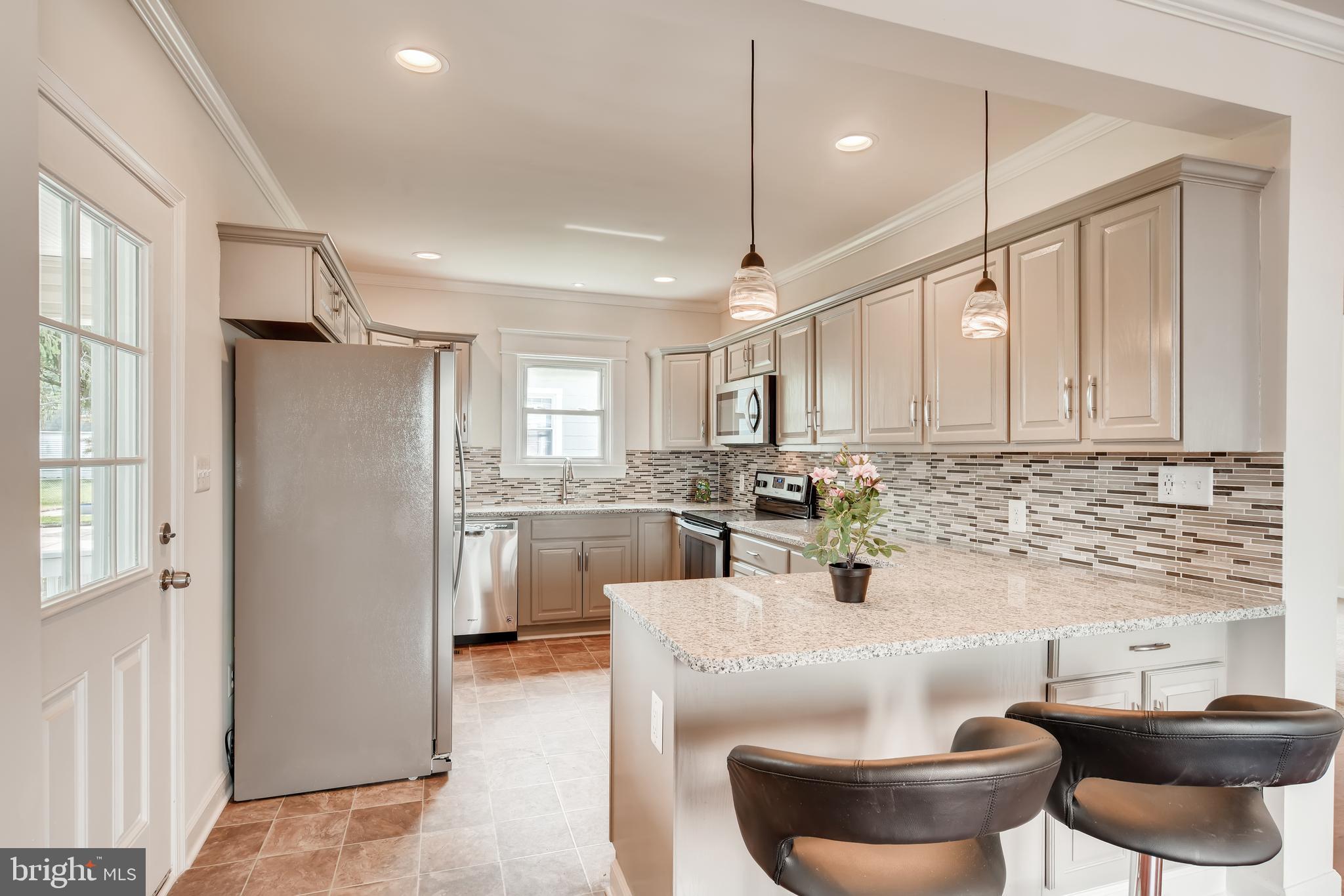 2610 Canterbury Road Baltimore, MD 21234 - Photo 7 of 29 GOURMET KITCHEN WITH BREAKFAST BAR