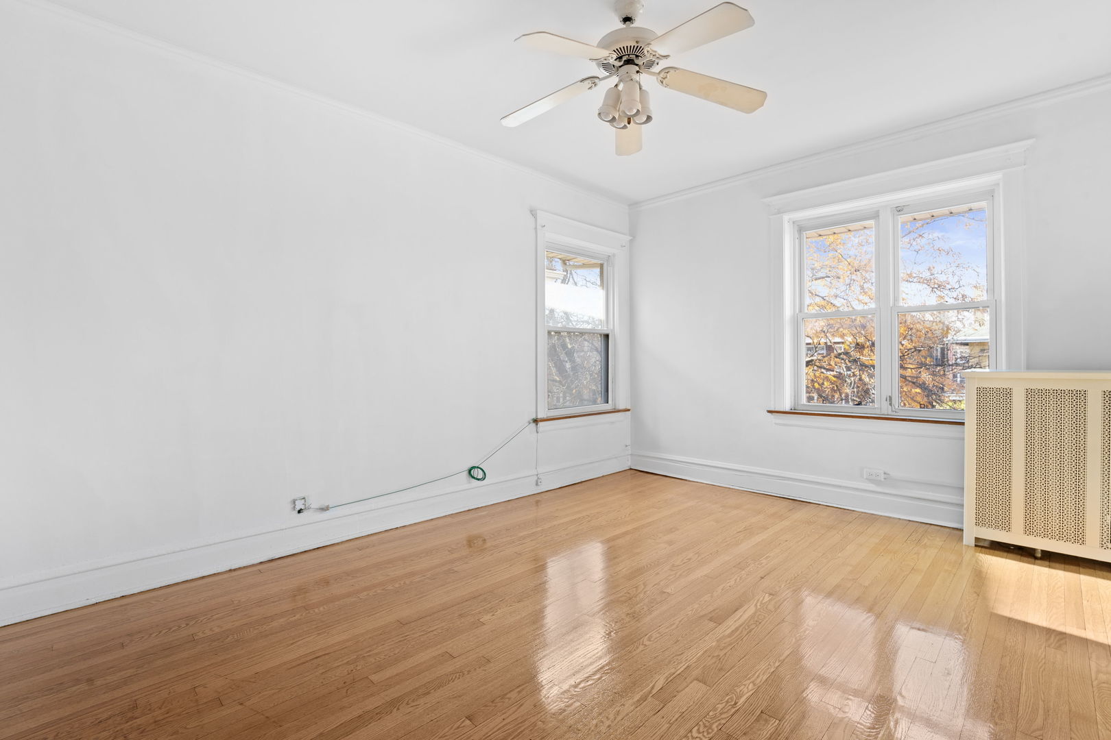 8015 South Sangamon Street Chicago, IL 60620 - Photo 13 of 17 wooden floor in an empty room with a window