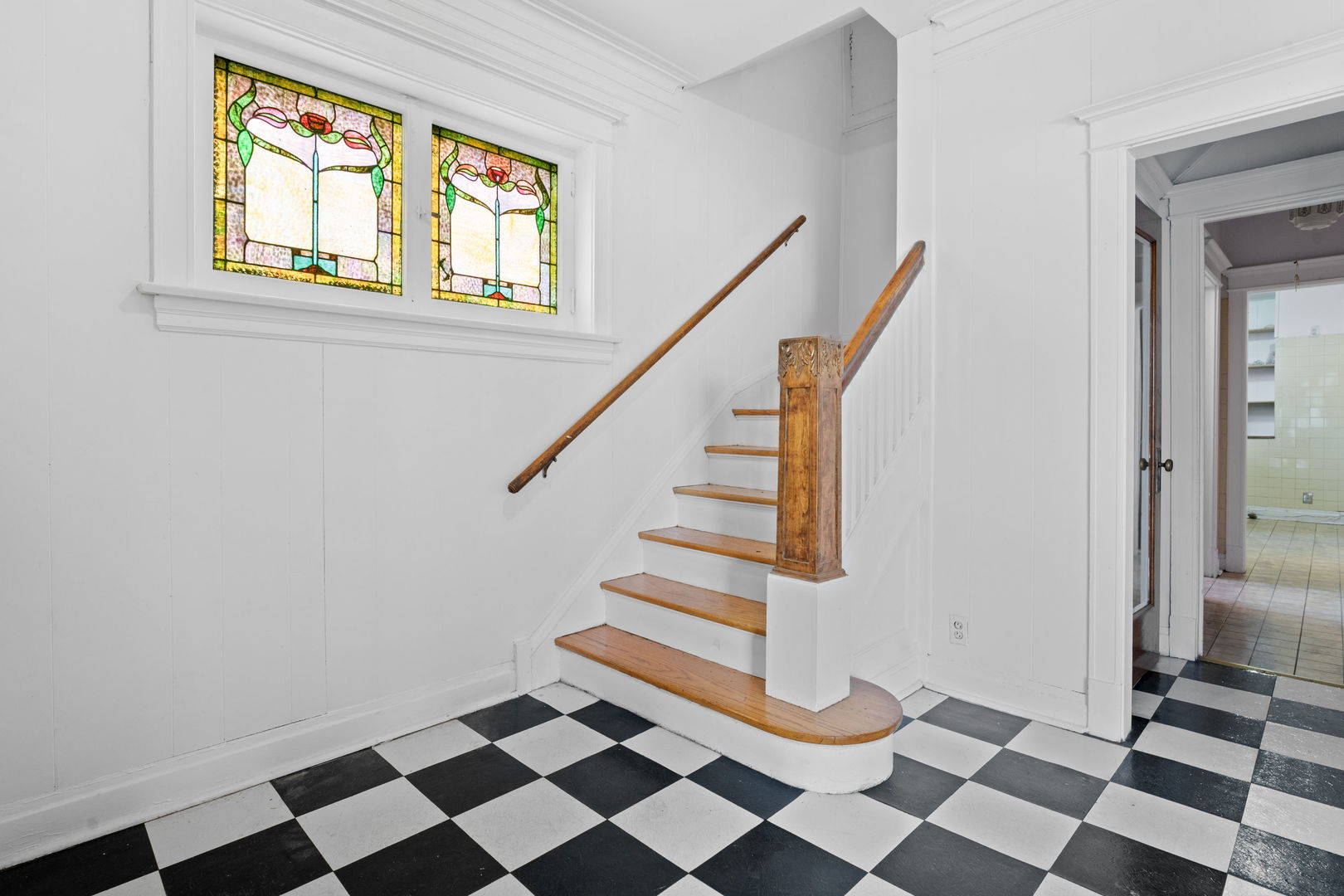 8015 South Sangamon Street Chicago, IL 60620 - Photo 2 of 17 a view of entryway with stairs and a black white checkered floor