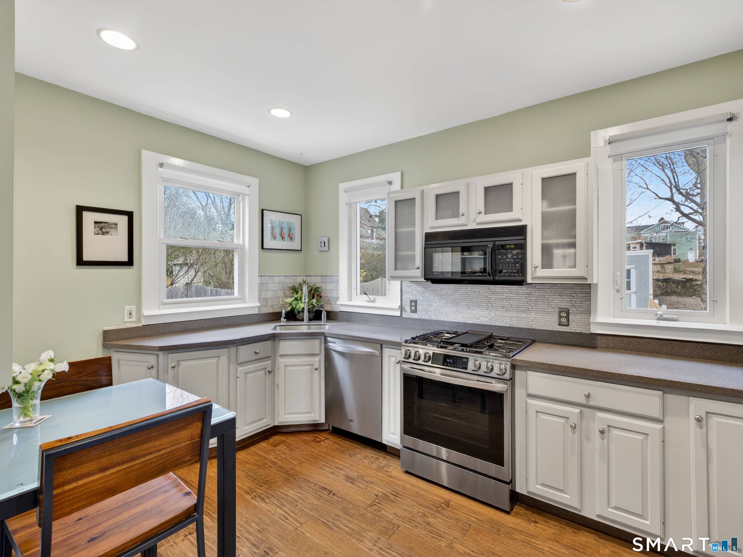 68 Ramsdell Street Groton, CT 06340 - Photo 13 of 31 a kitchen with stainless steel appliances granite countertop a stove a sink dishwasher a microwave oven and a refrigerator