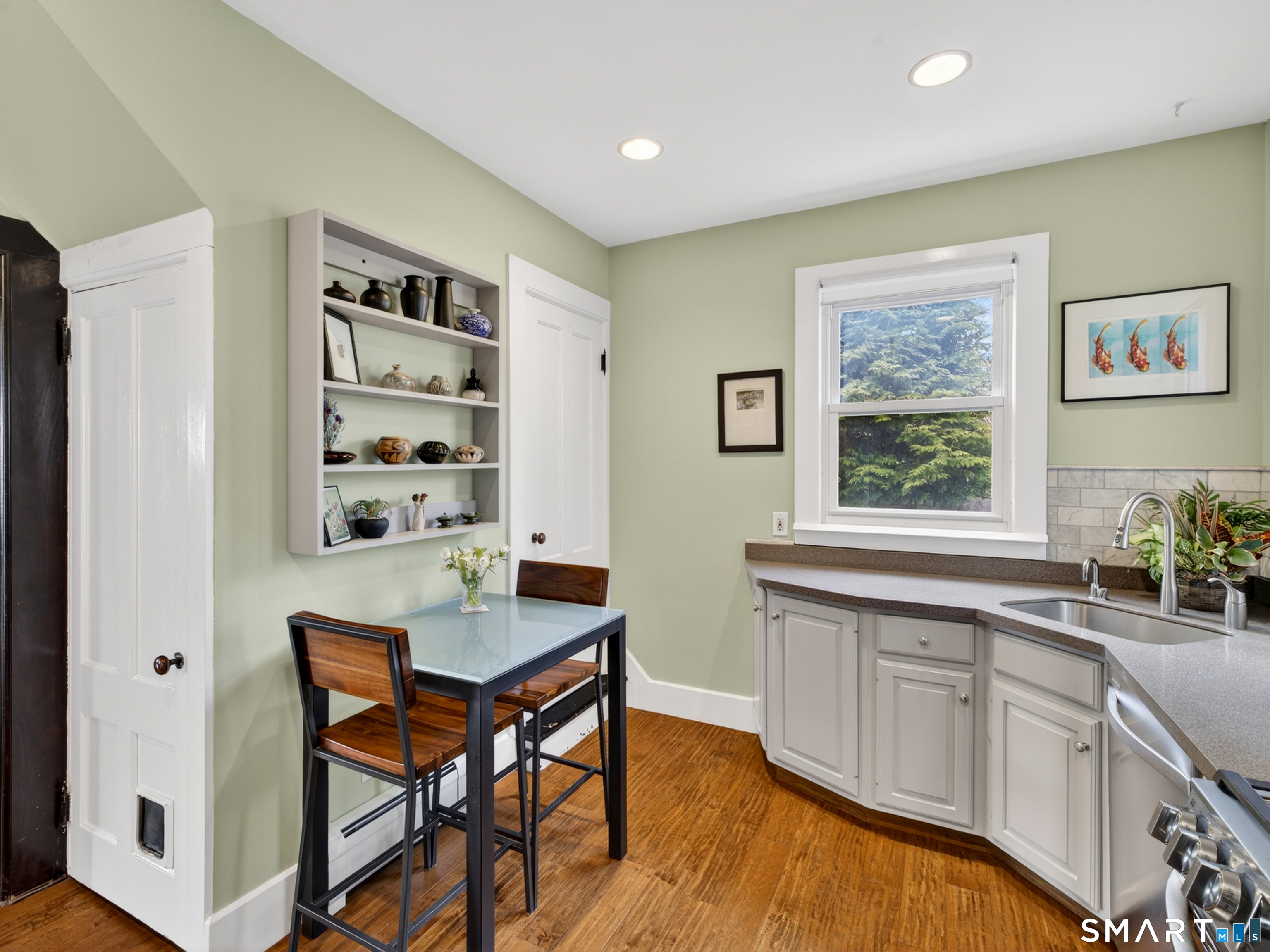 68 Ramsdell Street Groton, CT 06340 - Photo 14 of 31 a kitchen with granite countertop a sink cabinets and window