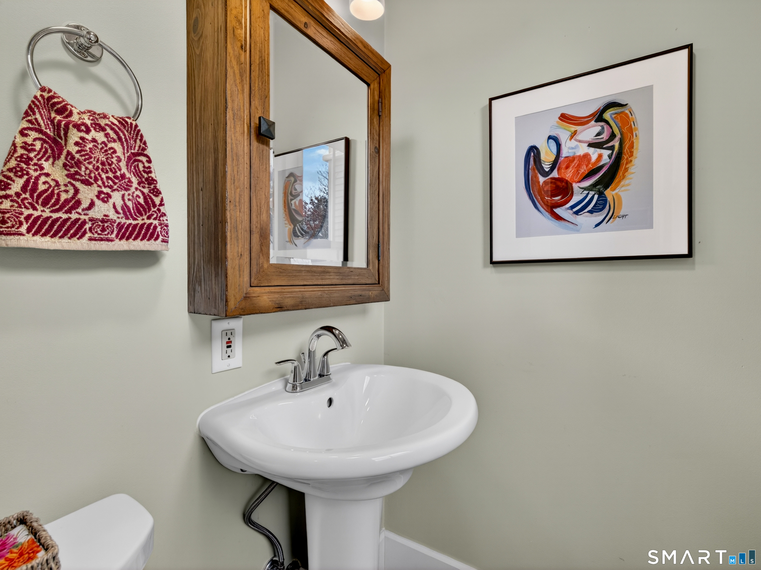 68 Ramsdell Street Groton, CT 06340 - Photo 18 of 31 a bathroom with a sink and a mirror