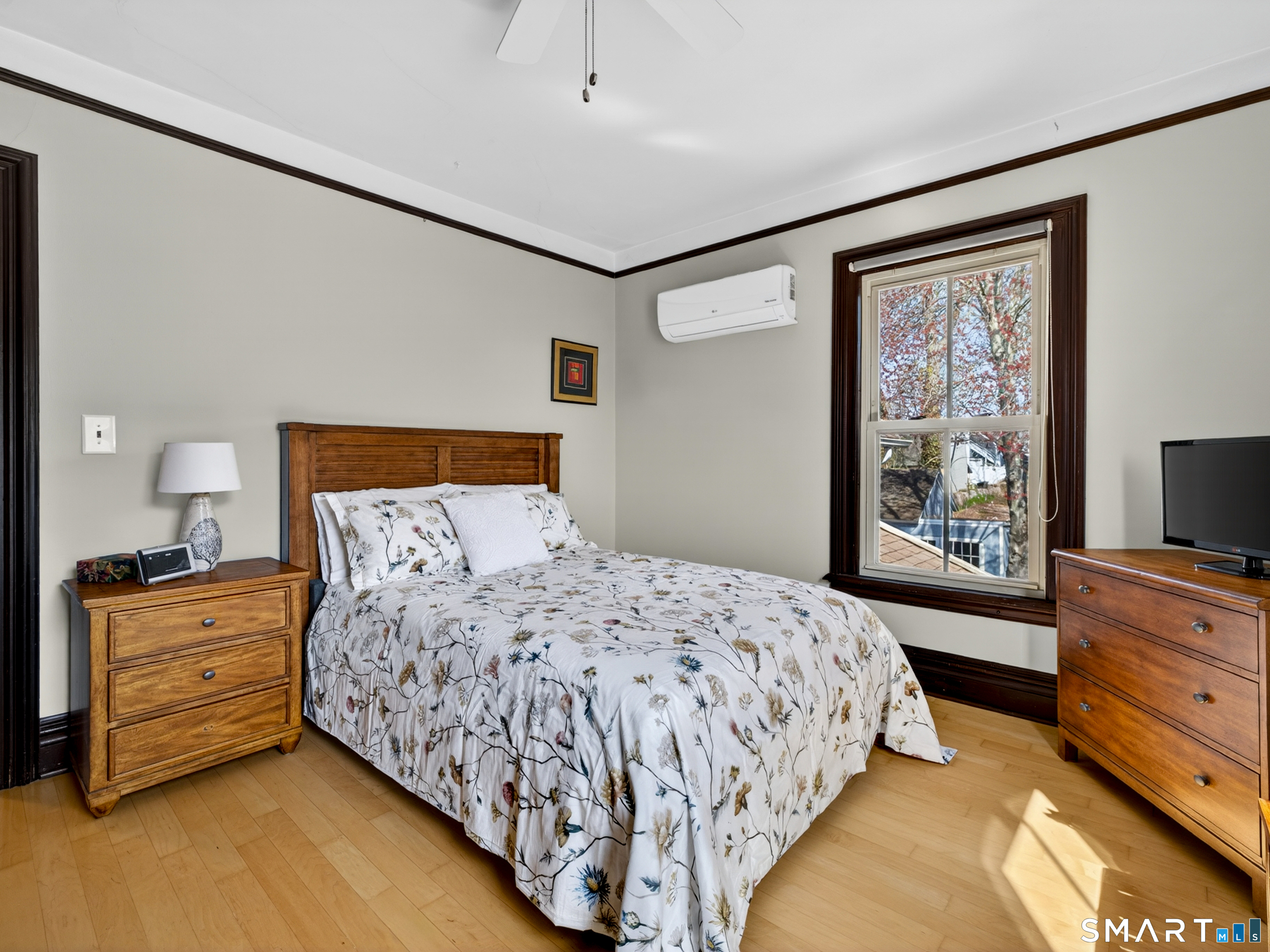 68 Ramsdell Street Groton, CT 06340 - Photo 22 of 31 a bedroom with a bed and a flat tv screen on dresser