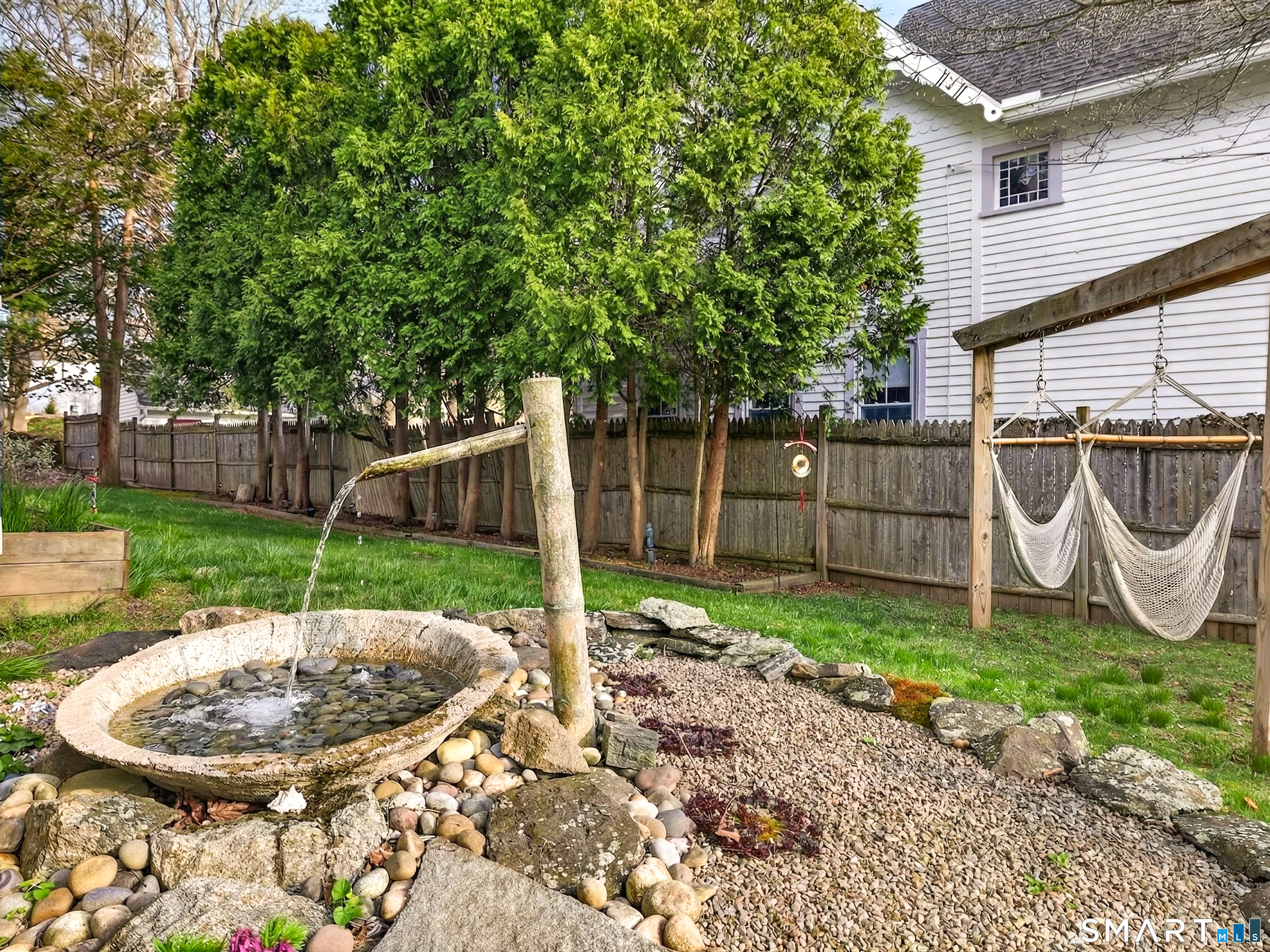 68 Ramsdell Street Groton, CT 06340 - Photo 29 of 31 a backyard of a house with table and chairs