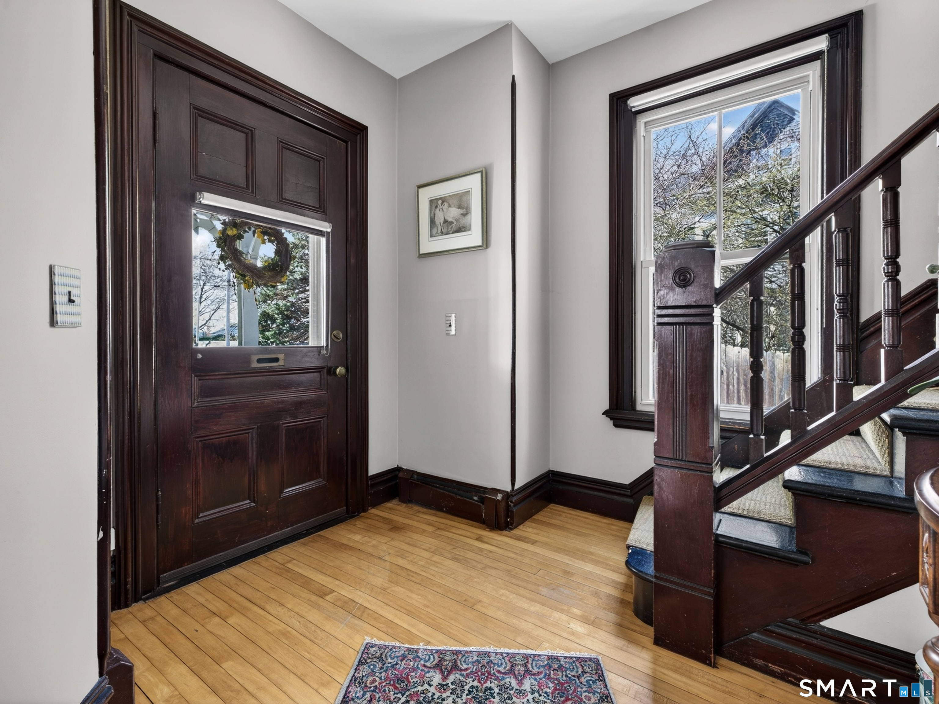 68 Ramsdell Street Groton, CT 06340 - Photo 7 of 31 a bedroom with a bed and wooden floor