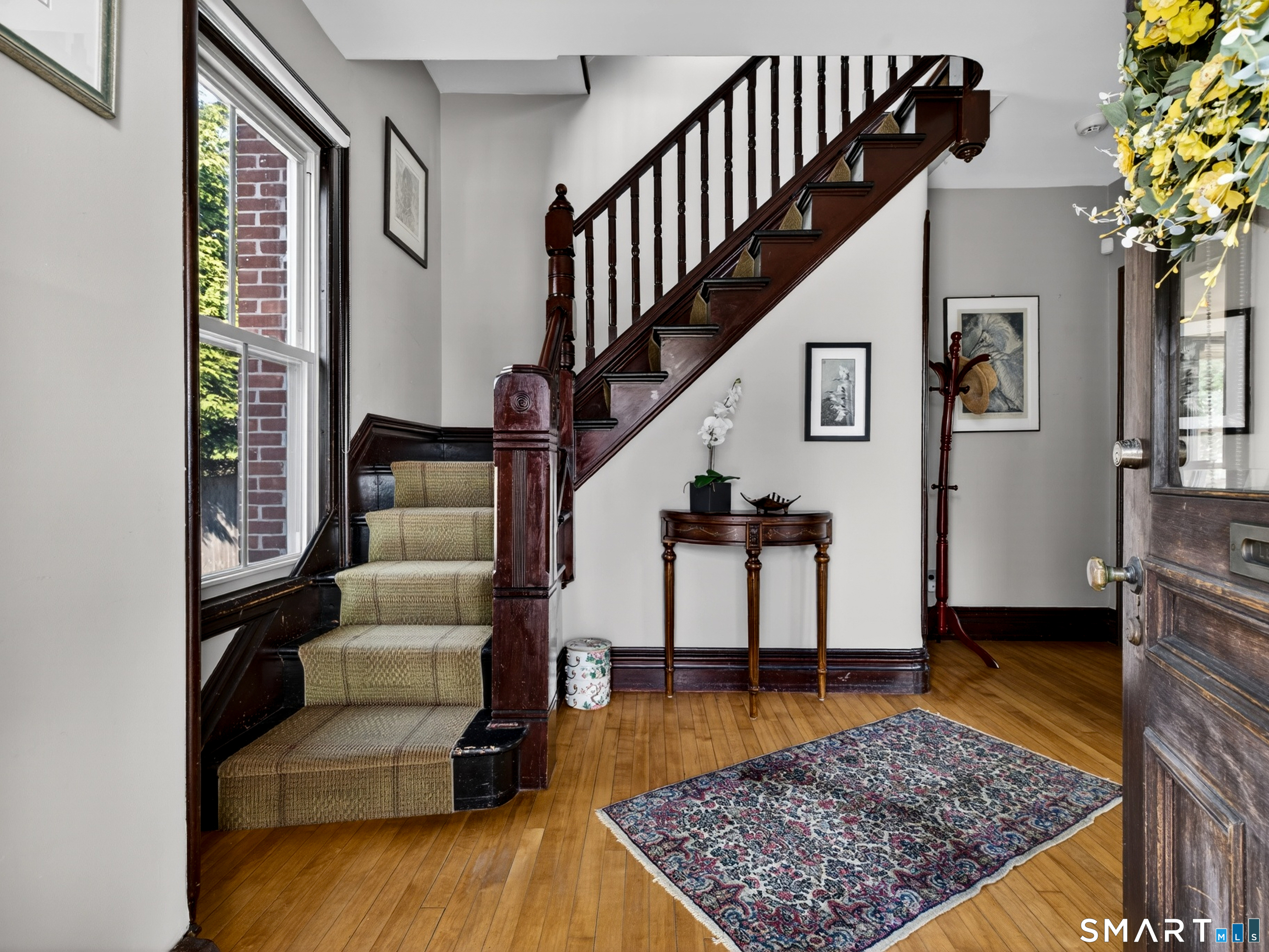 68 Ramsdell Street Groton, CT 06340 - Photo 8 of 31 a living room with furniture and a rug