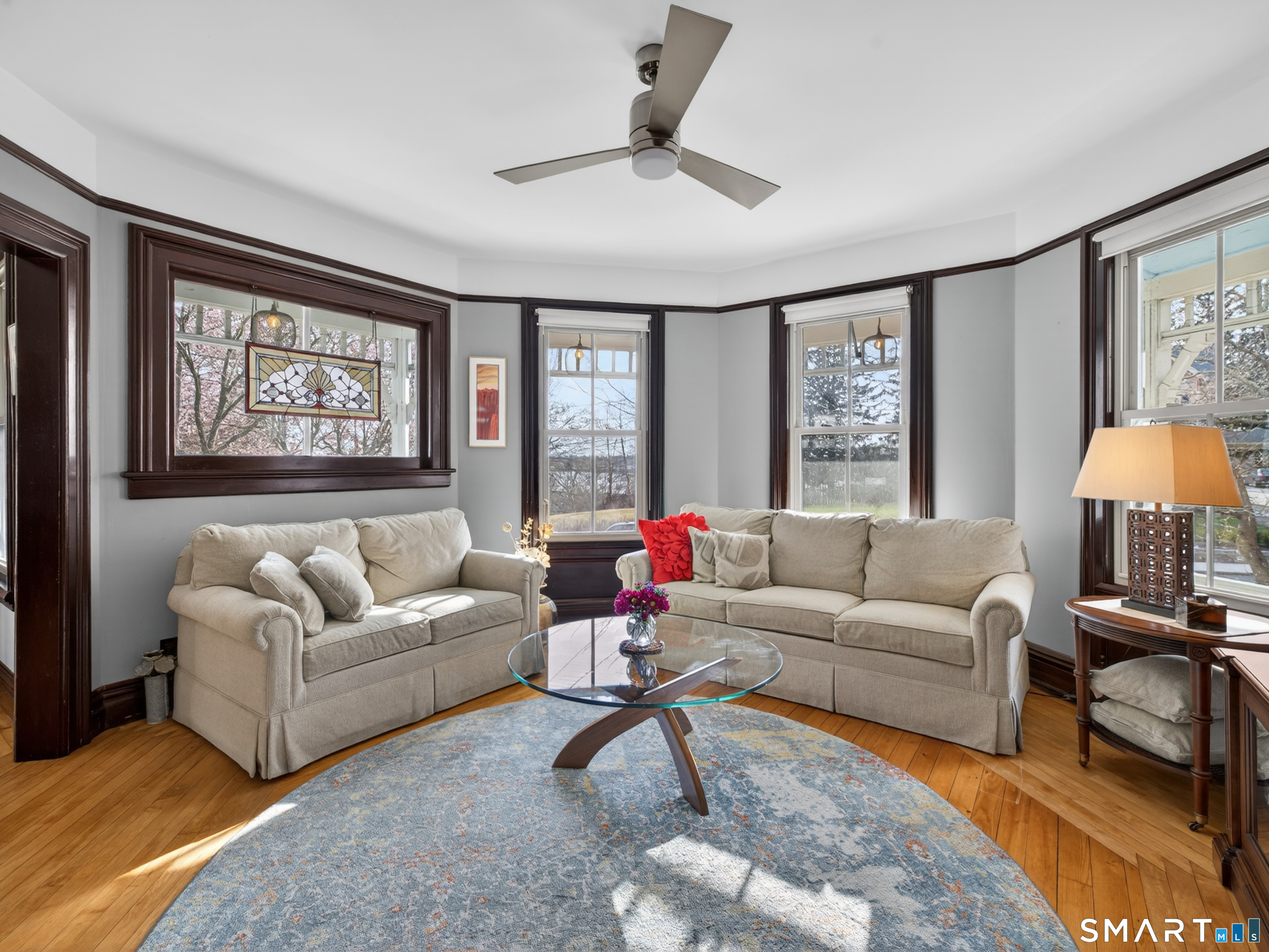 68 Ramsdell Street Groton, CT 06340 - Photo 9 of 31 a living room with furniture a rug and a large window