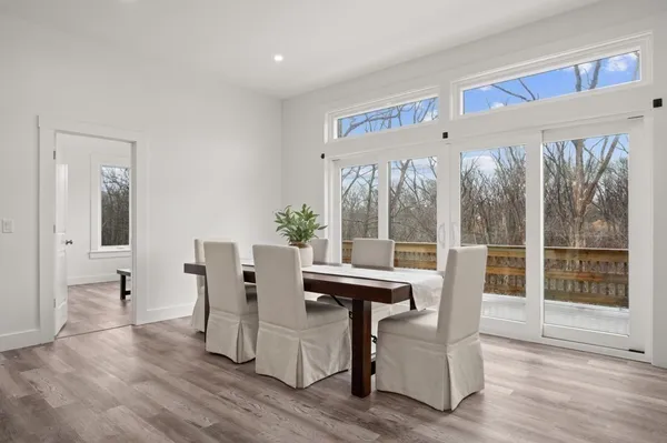 a view of a dining room kitchen with furniture and a potted plant