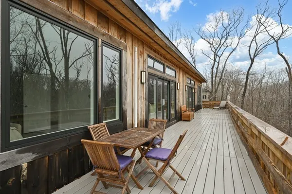 a view of balcony with double deck and wooden floor