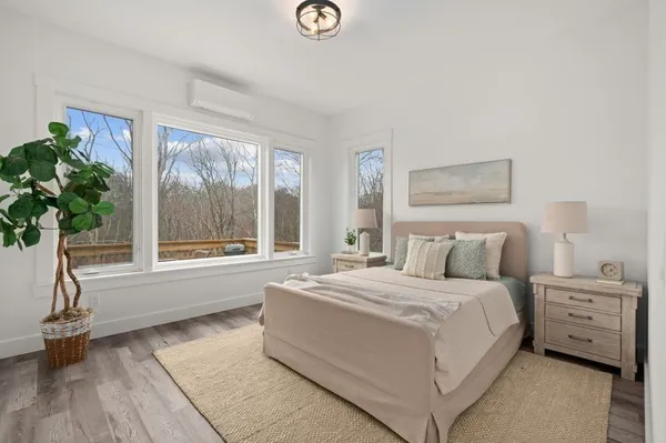 a bedroom with a bed and a hallway