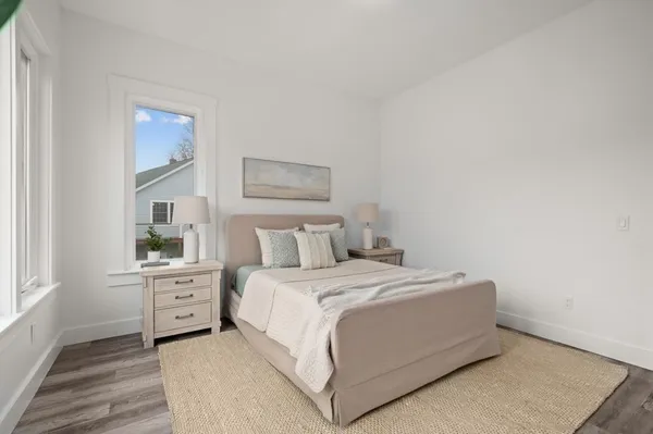 a view of a room with wooden floor