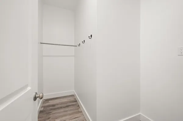 a bathroom with a shower a sink and a mirror
