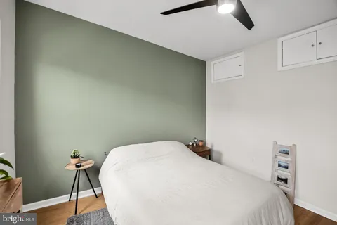 a bedroom with a bed and a table