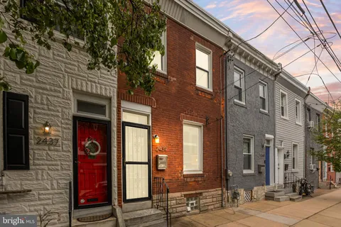 a front view of a building with red brick walls