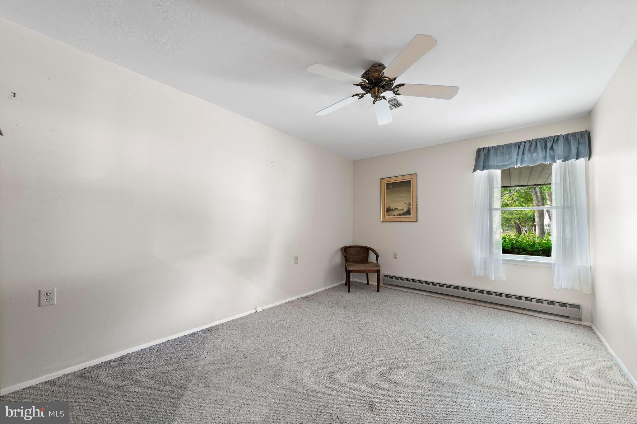43B Sycamore Access Road Manahawkin, NJ 08050 - Photo 23 of 40 a view of a livingroom with a ceiling fan and a window
