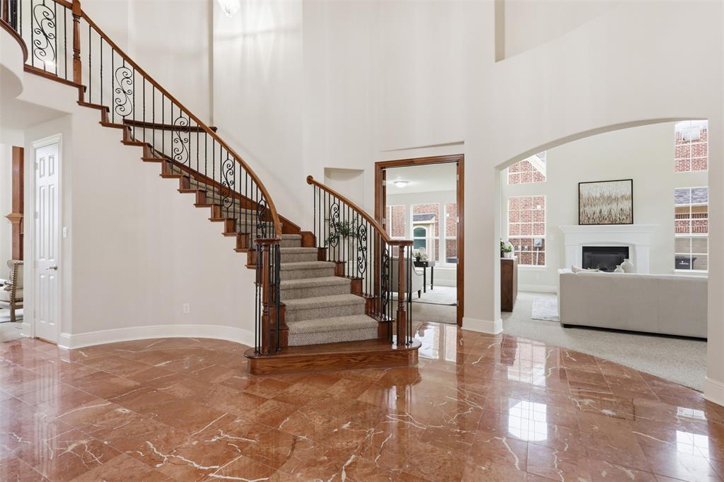 2841 Meadow Ridge Drive Prosper, TX 75078 - Photo 4 of 40 a view of entryway and hall with wooden floor