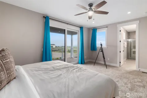 a living room view with a floor to ceiling window and a floor to ceiling window