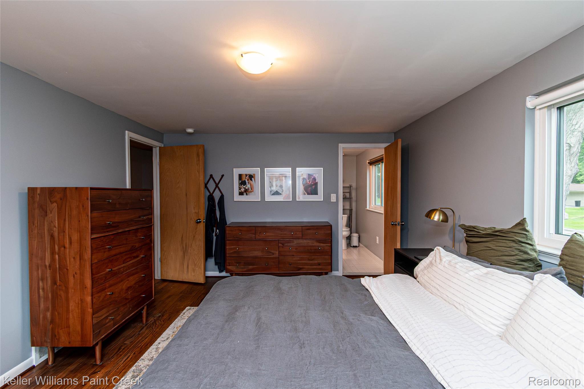 7093 Stonebrook Road West Bloomfield, MI 48322 - Photo 36 of 64 Room featuring light gray walls and wood-finish flooring